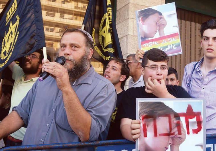 Sparring: Members of the Lehava movement protest. A sign reads, ‘Father, where is my mother?’