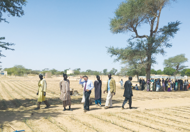 WOMEN IN the Senegalese village of Darou Fanaye sing and dance as Ambassador Paul Hirschson inspects an Israelisupported drip irrigation project.