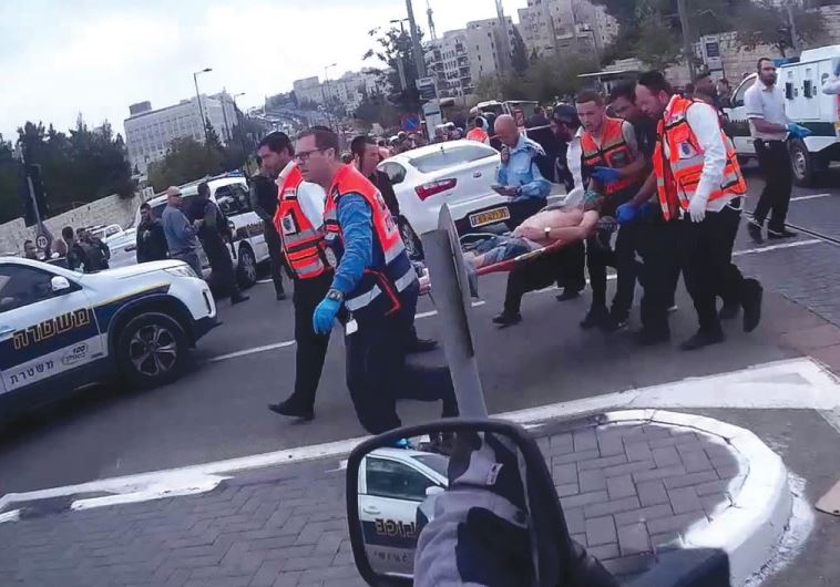 UNITED HATZALAH volunteers evacuate a wounded victim from a terrorist attack in Jerusalem.