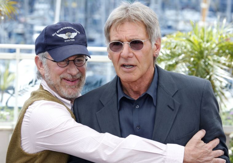 US director Steven Spielberg (L) positions cast member Harrison Ford at a photocall for the film "Indiana Jones and the Kingdom of the Crystal Skull" at the 61st Cannes Film Festival May 18, 2008.