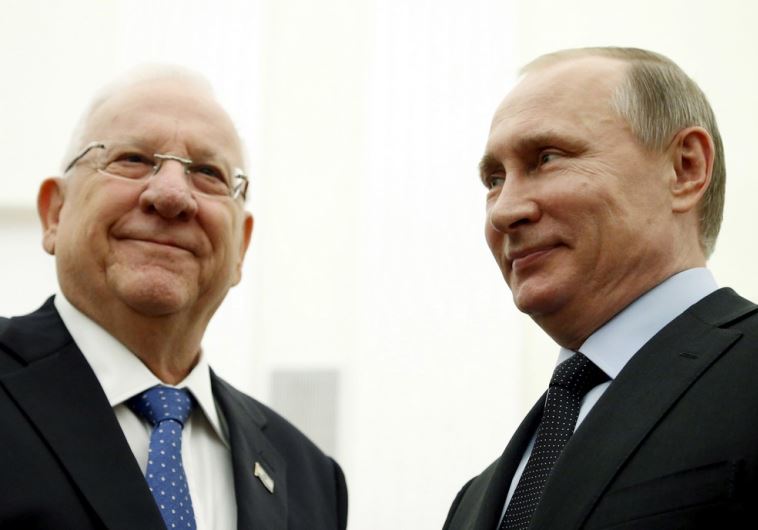 Russia's President Vladimir Putin (R) meets with his Israeli counterpart Reuven Rivlin at the Kremlin in Moscow