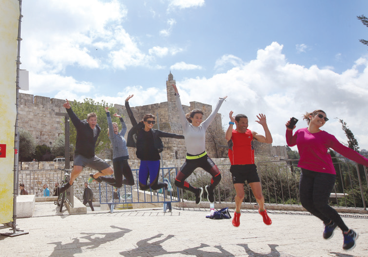 US ACTRESS Rachele Brooke Smith (third left) and friends get ready for the Jerusalem Marathon near Jaffa Gate yesterday.