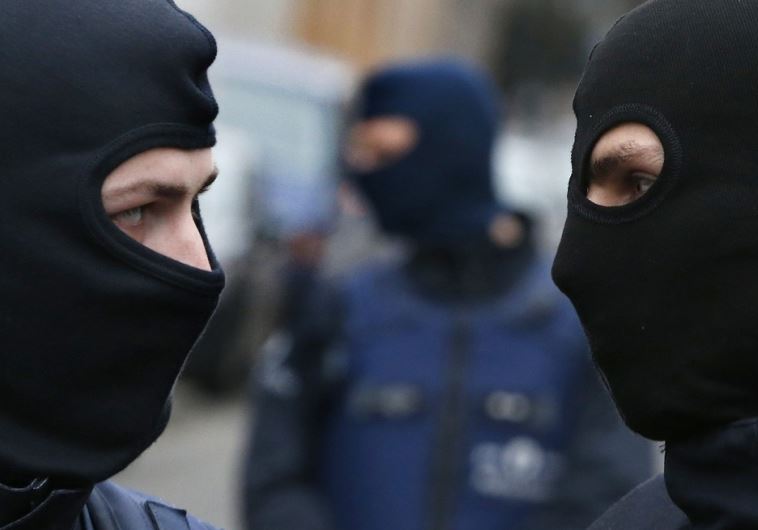 Police at the scene of a security operation in the Brussels suburb of Molenbeek in Brussels