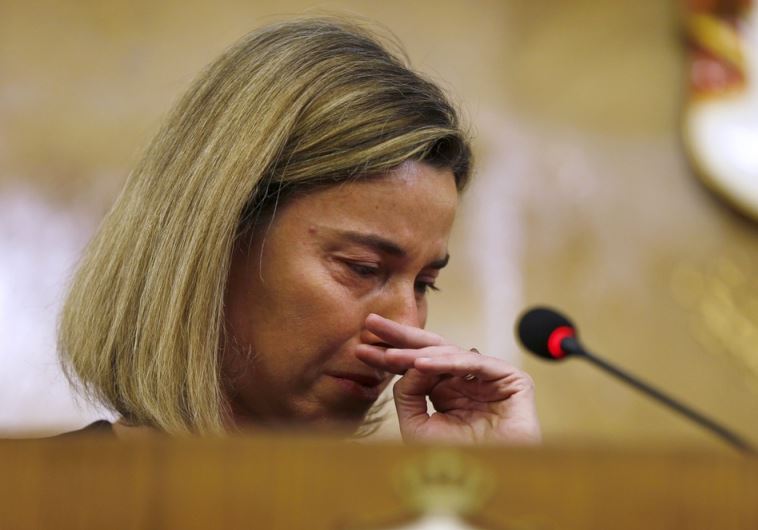 European Union foreign policy chief Federica Mogherini reacts to news of the Belgium blasts in Amman