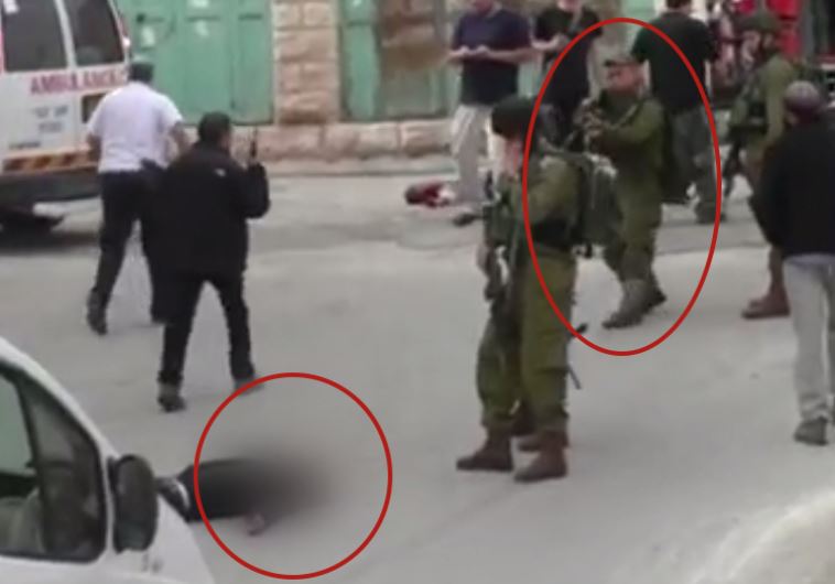 IDF soldier shoots subdued Palestinian