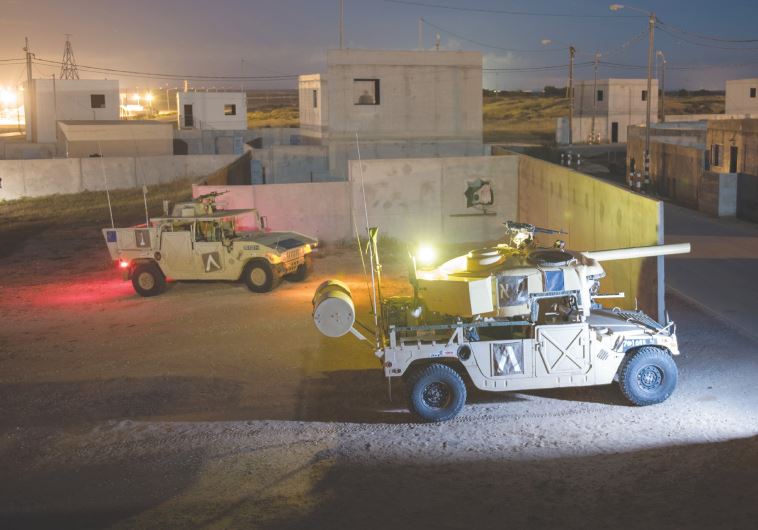 HUMVEES ARE seen during a combat exercise this week. Using the Humvees is much cheaper than using armored fighting vehicles.