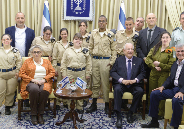 PRESIDENT REUVEN RIVLIN and his wife, Nechama, host a delegation of volunteer soldiers with special needs yesterday
