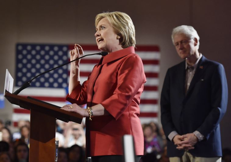 Democratic US presidential candidate Hillary Clinton speaks to supporters with her husband former president Bill Clinton (R) at her side in Las Vegas