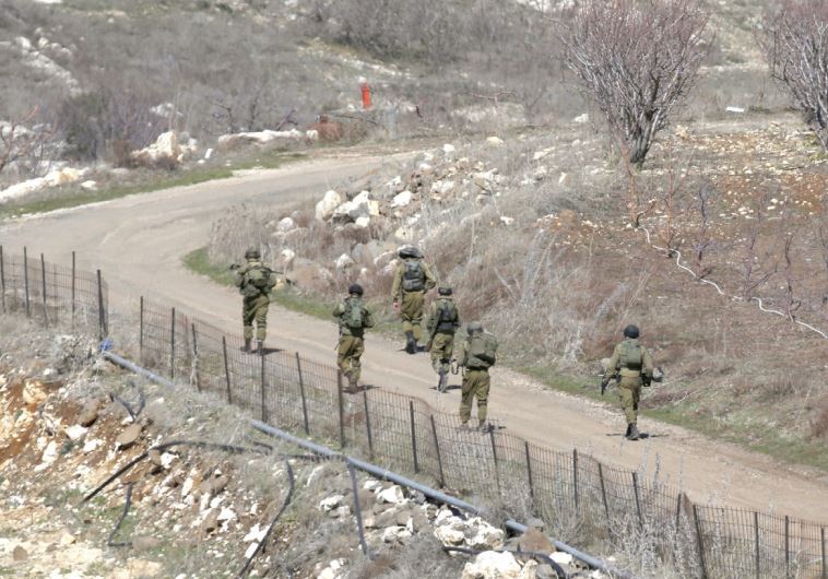 SOLDIERS PATROL a road near Majdal Shams in the Golan.