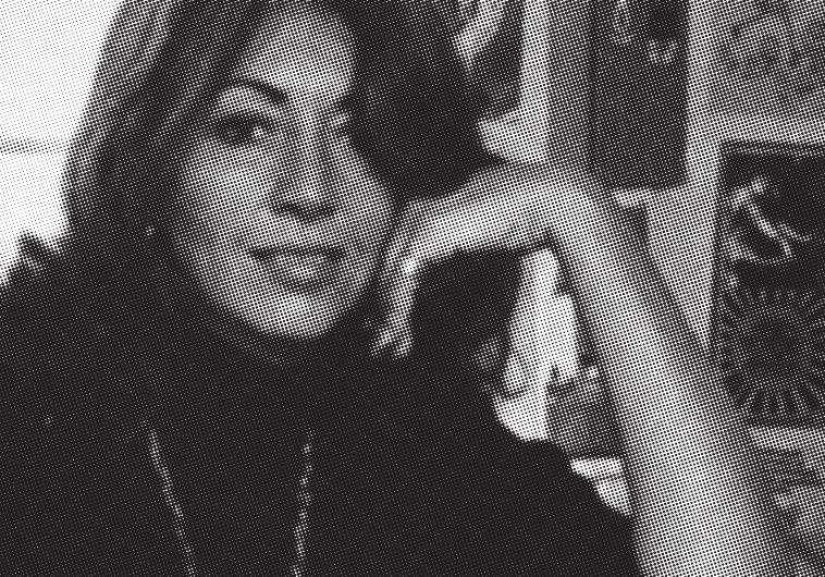 Ace Mossad agent Sylvia Raphael strikes a pose in her apartment in Paris in the Seventies