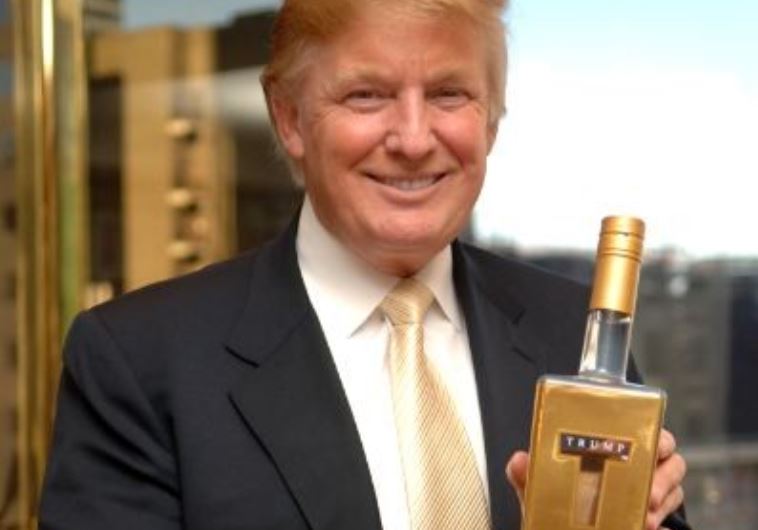 Donald Trump holds a bottle of the vodka named after him