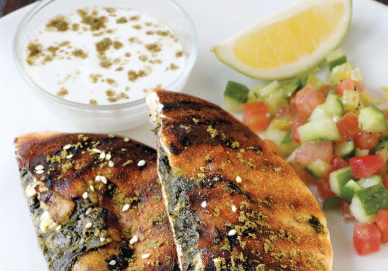 Spinach and feta arayes from ‘Israel Eats.’