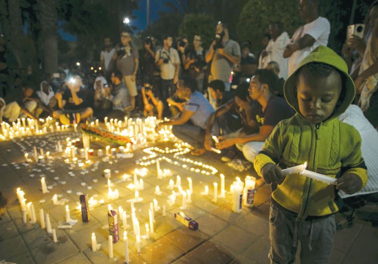 Israelis and fellow community members attend a memorial ceremony in Tel Aviv for Habtom Zarhum, an Eritrean migrant who was mistaken for a gunman at a shooting attack in Beersheba, in October 2015