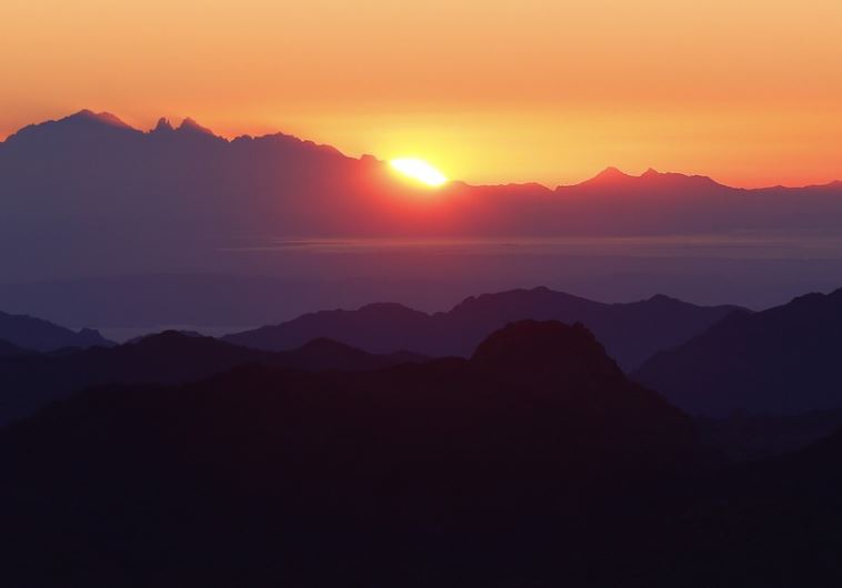 The sunrise is seen from the summit of Mount Moses, near the city of Saint Catherine, in the Sinai Peninsula
