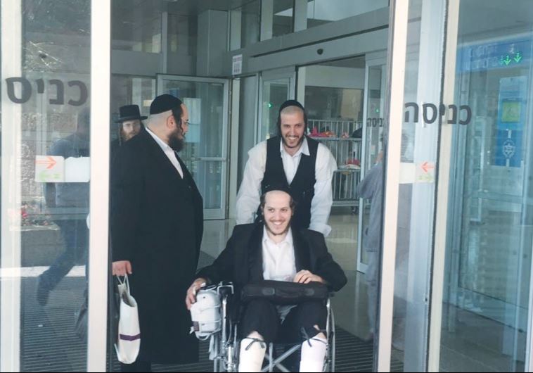 CHAIM WINTERNITZ is wheeled out of Jerusalem’s Hadassah-University Medical Center in Ein Kerem