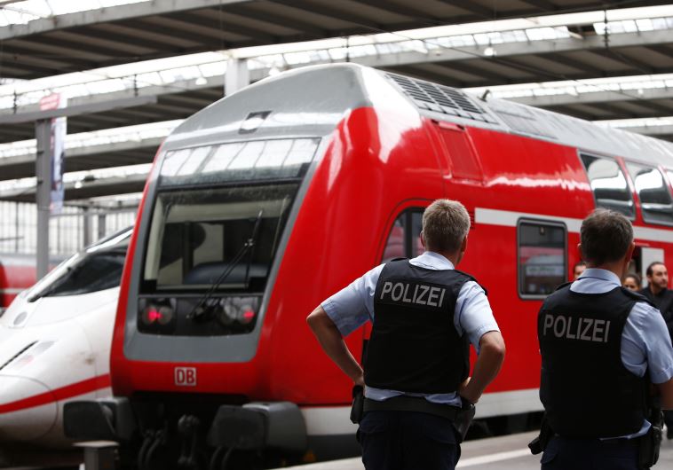 German policemen monitor the trains at the main station in Munich, Germany September 14, 2015.