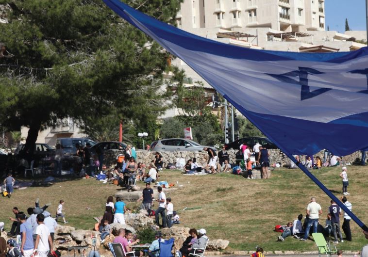 Israelis enjoy an Independence Day barbecue in Jerusalem’s Gan Sacher last year