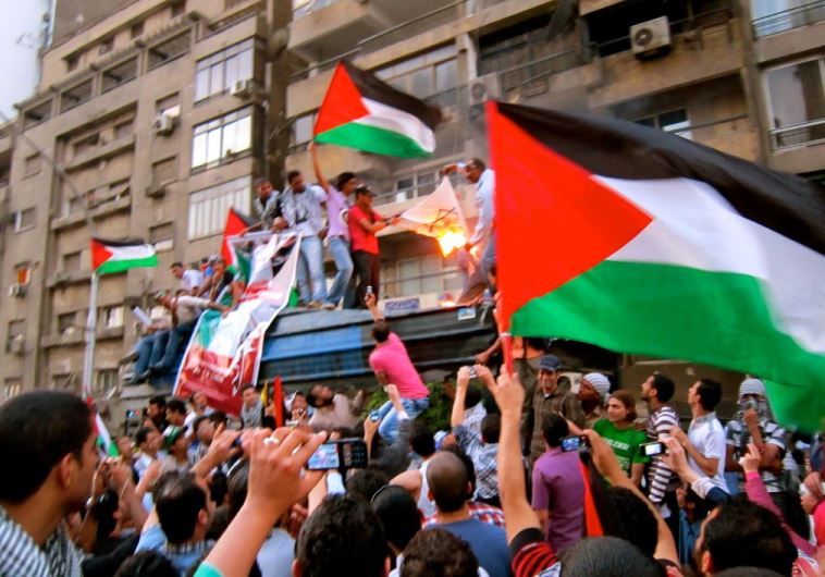 Burning the Israeli flag at Israel's embassy in Cairo, 2011