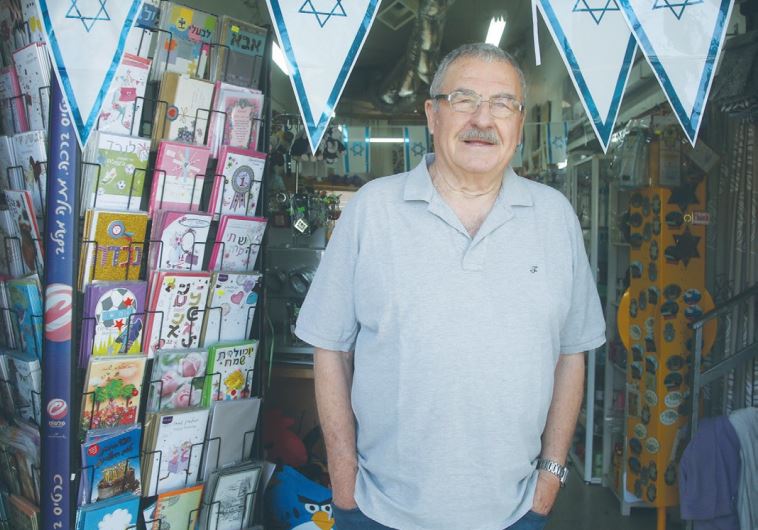 SHMUEL SHERF stands in the entrance to his family-owned toy store in Katzrin.