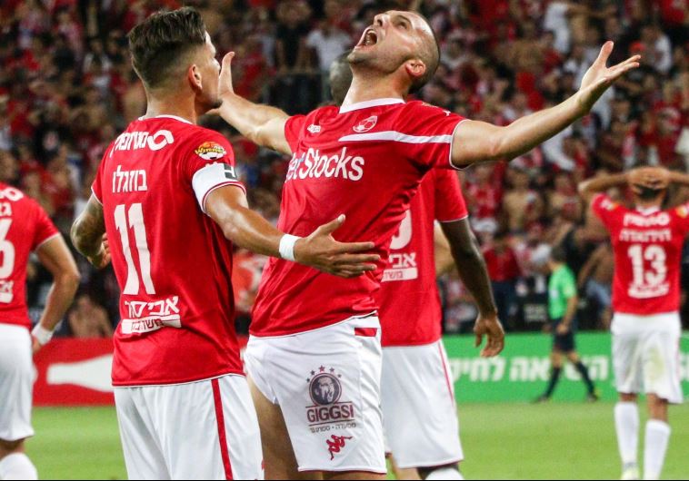 Hapoel Beersheba striker Ben Sahar (right) and teammate Maor Buzaglo, who both scored last night, celebrate the club's first Premier League championship in 40 years.
