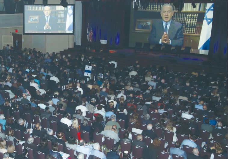 ATTENDEES AT The Jerusalem Post’s fifth annual conference in New York listen to a pre-recorded address from Prime Minister Benjamin Netanyahu yesterday.