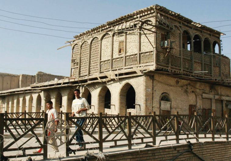 An Iraqi walks past a traditional house in Basra. In 1940, Jews of Iraq suffered an unprecedented pogrom that affect communities in Baghdad, Basra and elsewhere.