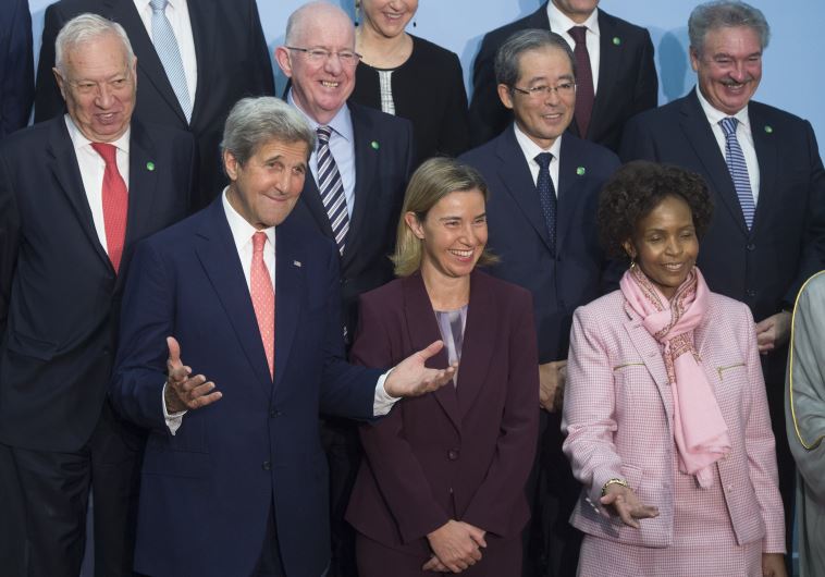 US Secretary of State John Kerry (L), European Union High Representative for Foreign Affairs Federica Mogherini (C) and South African Foreign Minister Maite Nkoana-Mashabane (R) arrive for a family photo during an international and interministerial meeting in a bid to revive the Israeli-Palestinian 