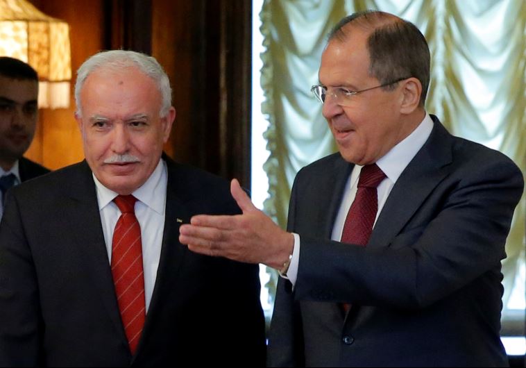 Russian Foreign Minister Sergei Lavrov (R) shows the way to his PA counterpart Riyad al-Maliki during a meeting in Moscow, Russia June 8, 2016. 