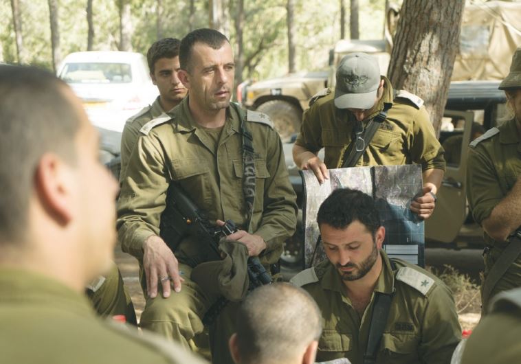 LT.-COL. KAMEEL TAFISH, deputy commander of Brigade 300, briefs commanders and soldiers.