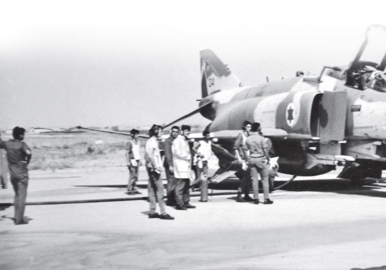 Pilots gather before takeoff and the start of Operation Mole Cricket 19, in June 1982
