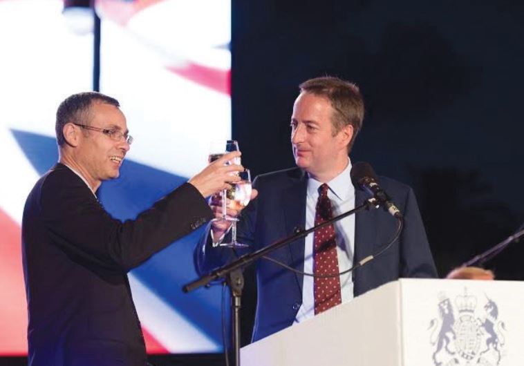 TOURISM MINISTER Yariv Levin (left) and British Ambassador David Quarrey toast the queen of England on her 90th birthday.