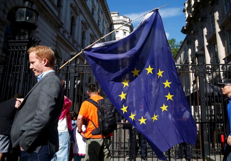 A man carries a EU flag, after Britain voted to leave the European Union