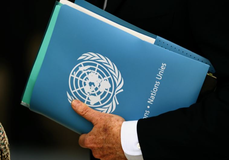 Envoy holds folder at the 31st Session of the Human Rights Council at the U.N. European headquarters in Geneva, Switzerland