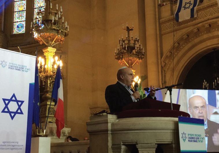 JAFI head Natan Sharansky wishes success yesterday in Paris to French Jews about to make aliya.