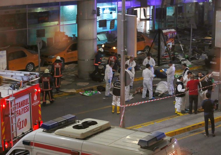 Forensic experts work outside Turkey's largest airport, Istanbul Ataturk, Turkey, following a blast, June 28, 2016.