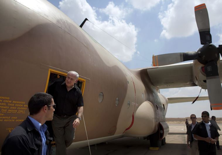 Prime Minister Benjamin Netanyahu during a visit to Hatzerim air base exits a C-130 Hercules aircraft used in the rescue of Israeli hostages at Entebbe in 1976.