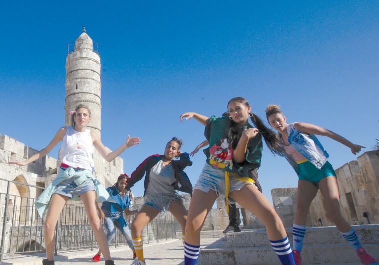 DANCERS OUTSIDE the Tower of David in the capital are filmed yesterday as part of a hip hop video that hopes to portray the city as a cool place to visit. (