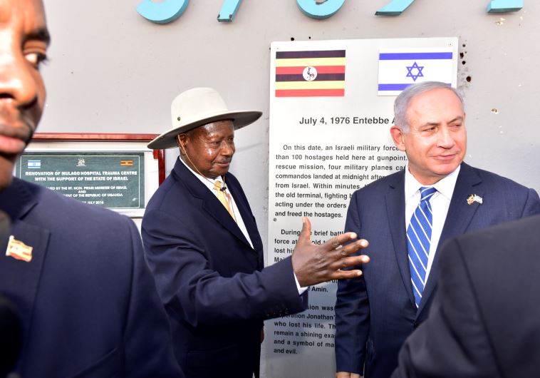 Uganda's President Yoweri Museveni (L) speaks to Israeli Prime Minister Benjamin Netanyahu (R) during a memorial service to commemorate the 40th anniversary of Operation Entebbe at the Entebbe airport in Uganda, July 4, 2016. 