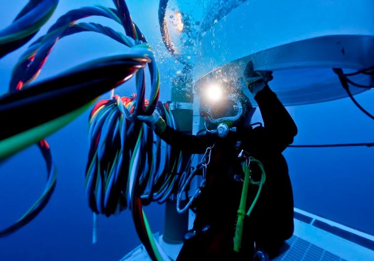  A DIVER FROM the Israel Navy’s Unit for Underwater Missions works with a welding torch in the sea depths