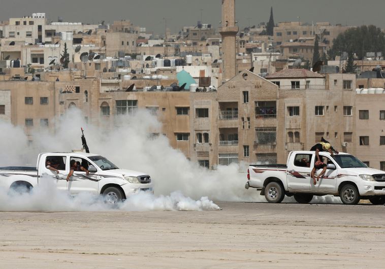 Jordanian special forces participate in an anti-terrorism drill at King Abdullah II Airbase in Amman, May 10