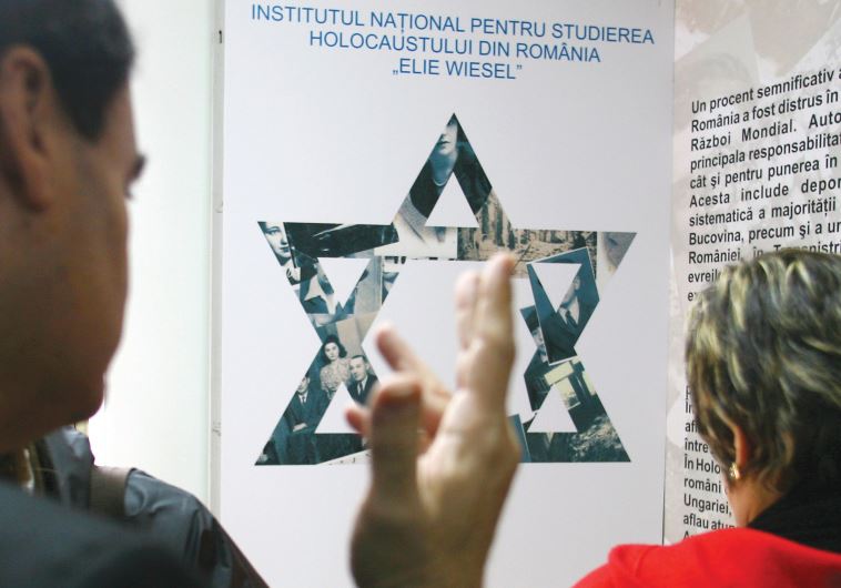 ROMANIAN JEWS visit an exhibition about the Holocaust in Romania at the Elie Wiesel Institute for Holocaust Studies during the annual Holocaust Remembrance Day in Bucharest in 2006.
