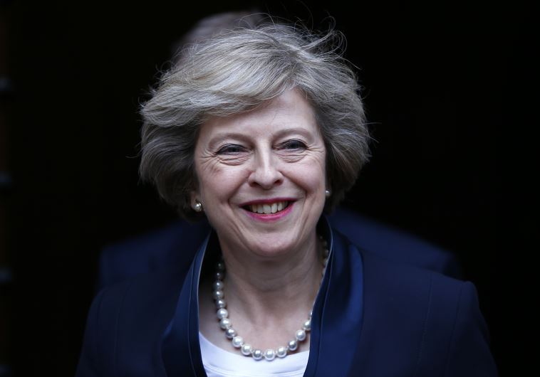Theresa May emerges to speak to reporters after being confirmed as the leader of the Conservative Party..
