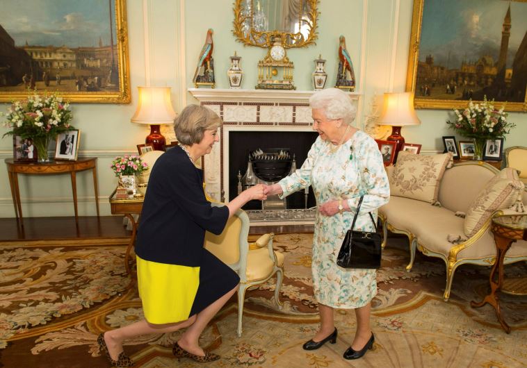 Britain's Queen Elizabeth welcomes Theresa May at the start of an audience in Buckingham Palace, where she invited her to become Prime Minister, in London July 13, 2016. 