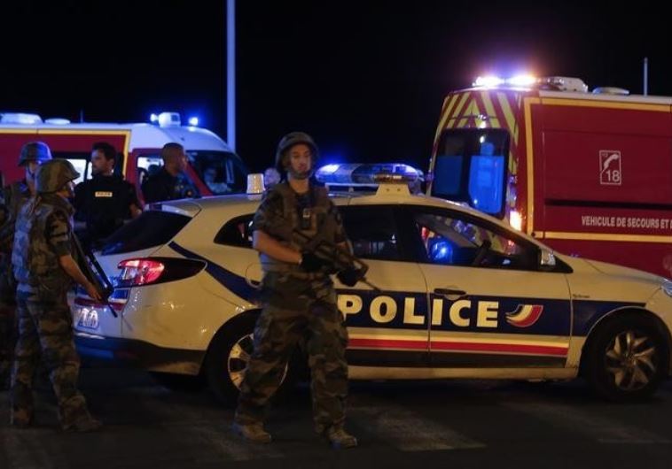 French soldiers and rescue forces are seen at the scene whare at least 30 people were killed in Nice, France, when a truck ran into a crowd celebrating the Bastille Day national holiday July 14, 2016. 