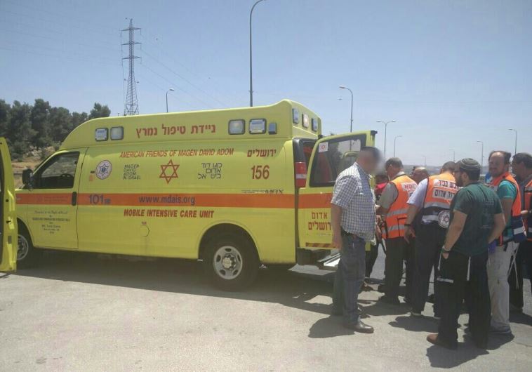 Ambulance at scene of stabbing attack in Gush Etzion, July 18, 2016