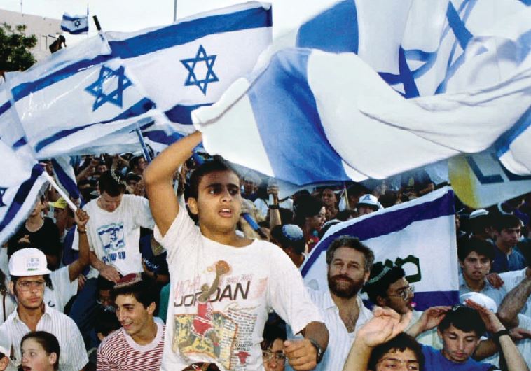 Israelis wave flags during a protest in June 1993 outside the US Consulate in Jerusalem against the plan to relinquish some of the Golan Heights for peace with Syria