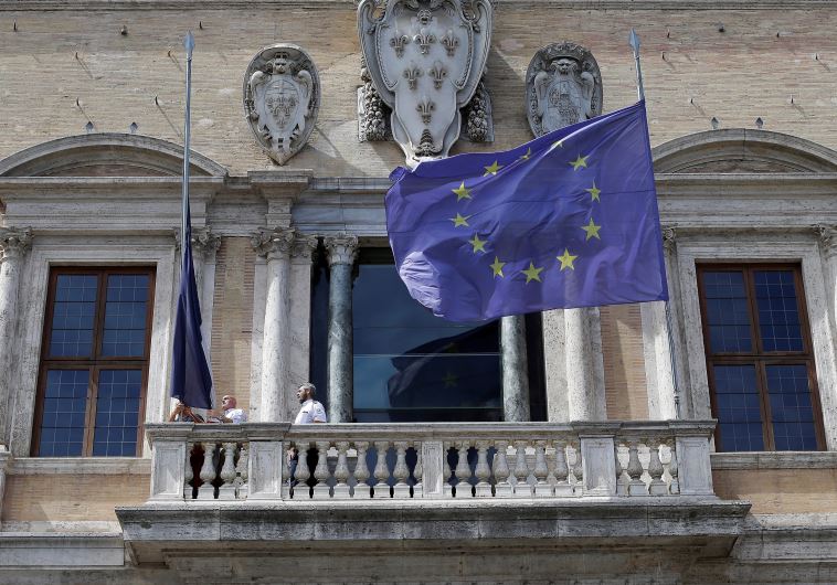 An European Union flag is lowered at half-mast in honor of the victims of the Bastille Day truck attack in Nice, outside the EU Parliament in Brussels, Belgium, July 15, 2016. 
