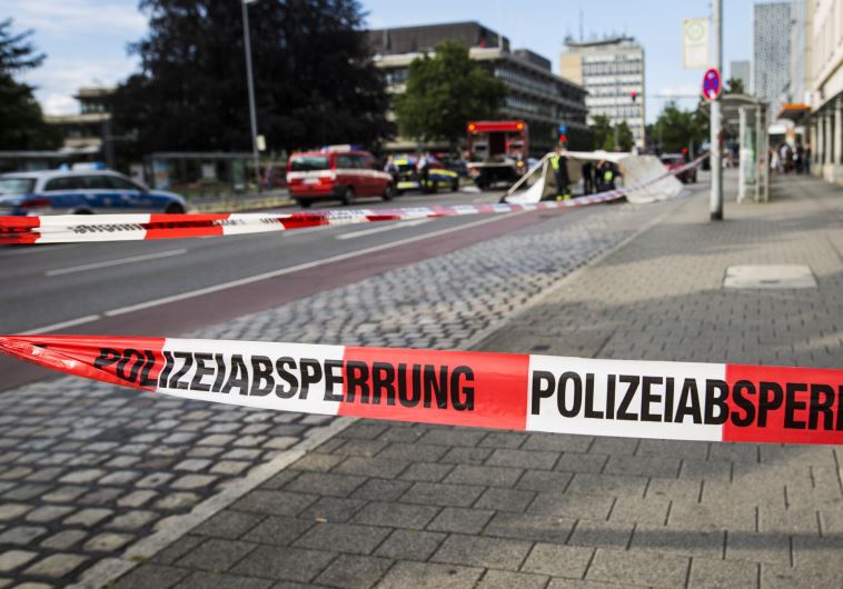 A police line is seen near the site where a Syrian asylum-seeker killed a woman and injured two people with a machete, on July 24, 2016 in Reutlingen, southern Germany.