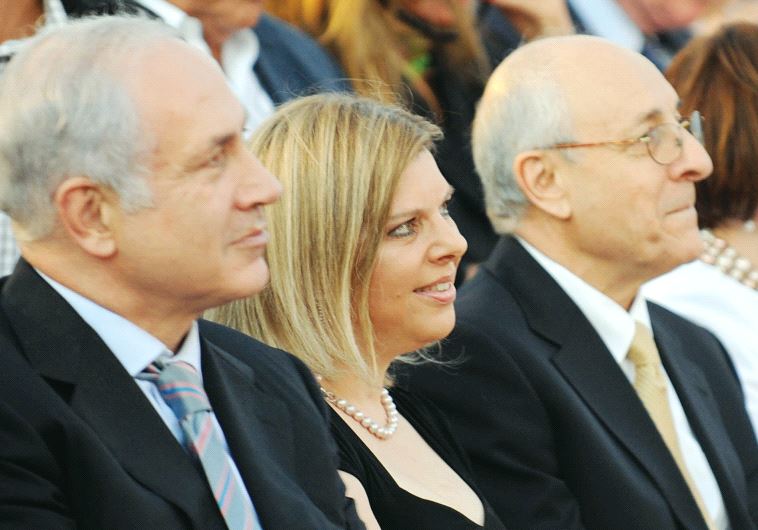 Attorney Yitzhak Molcho (right) sits with Prime Minister Benjamin Netanyahu and his wife Sara