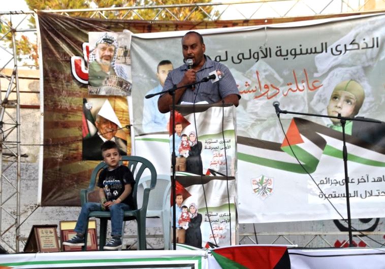 Nasr Dawabsha addresses rally in Duma and his nephew, Ahmad Dawabsha, sits by his side
